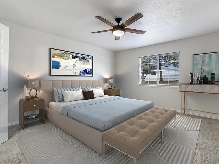 large master bedroom with bathroom, staged