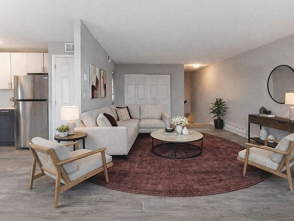 Step into comfort and style at Newpointe Apartments. Our spacious living room features modern design elements, perfect for relaxation and entertaining. Embrace your new lifestyle todayschedule a tour and find your ideal home!