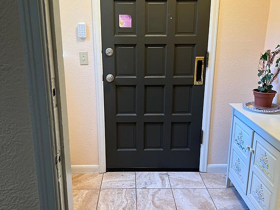 entrance way with room for cabinet coats, boots and shoes