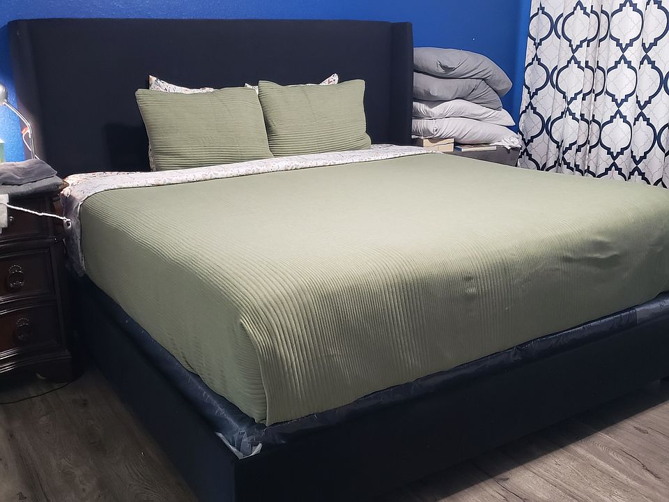 This is one of the well-maintained guest rooms, offering a clear reflection of the home's overall cleanliness, care, and attention to detail_creating a welcoming environment for visitors and showcasing pride in home upkeep.