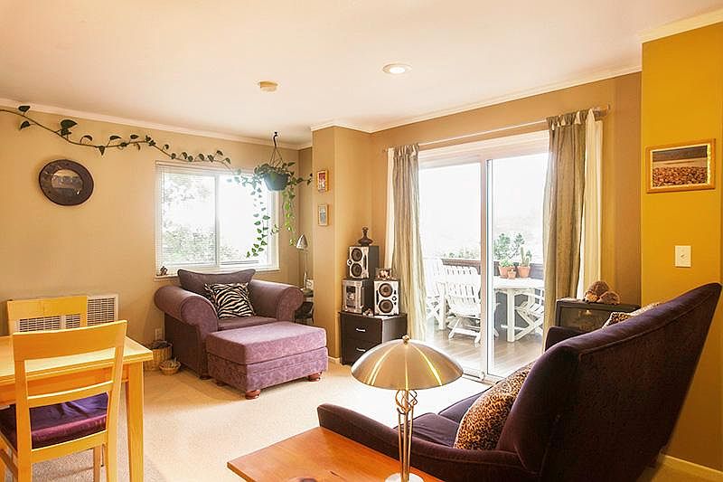 This apartment is unfurnished but these photos shows what you can do with the space. This living room is no longer carpeted. It now has a beautiful wood floor.