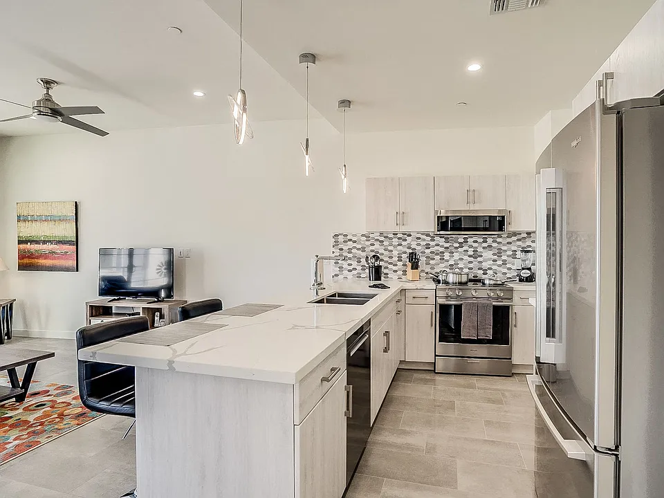 Stainless steel appliances with side-by-side refrigerator