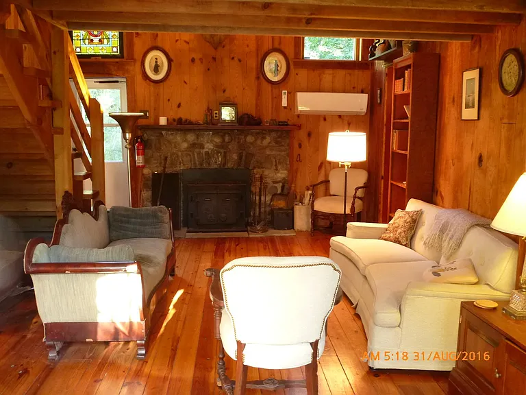 Living room with wood stove that kicks out the heat!