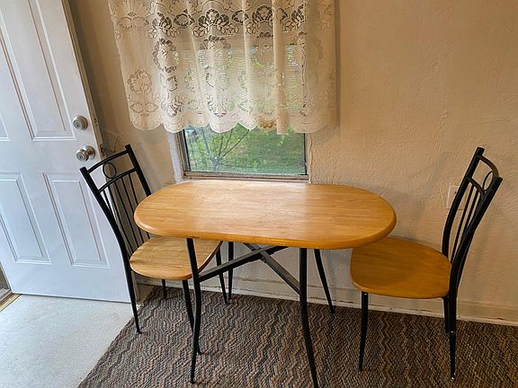 Small table with chairs in kitchen looking to the west