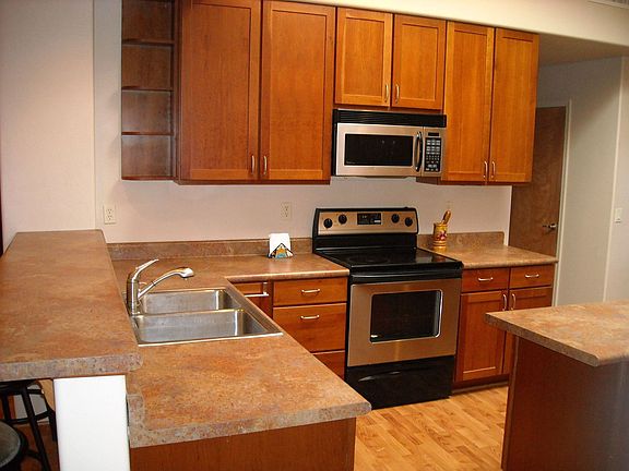 huge kitchen with cherry cabinets and a walk in pantry