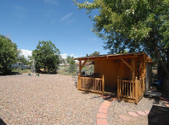 Totally fenced back yard with 2 sheds