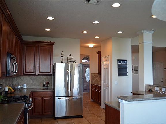 View from breakfast area.  Double doors lead to large pantry.  Butler's pantry leads to formal dining room.  Utility room is across from butler's pantry.