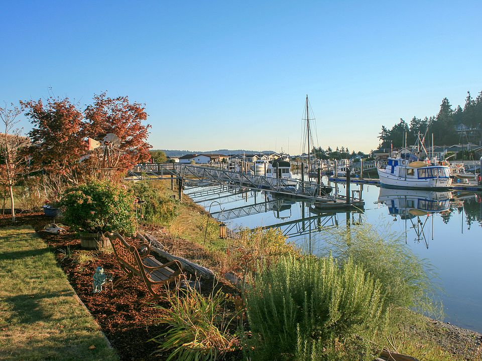 View from the back yard to the canal. On the right side of the photo is the community dock
