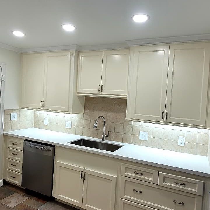 Newly painted kitchen, new countertops, sink, and new appliances (refrigerator, oven and dishwasher).