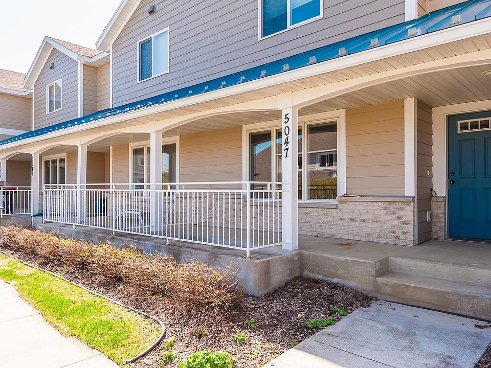 Front Entrance with with Rod Iron Railing Covered Porch for Relaxing
