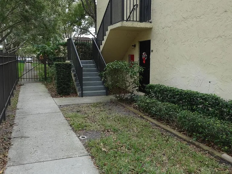 Private downstairs end unit entrance. 
Gated inner courtyard