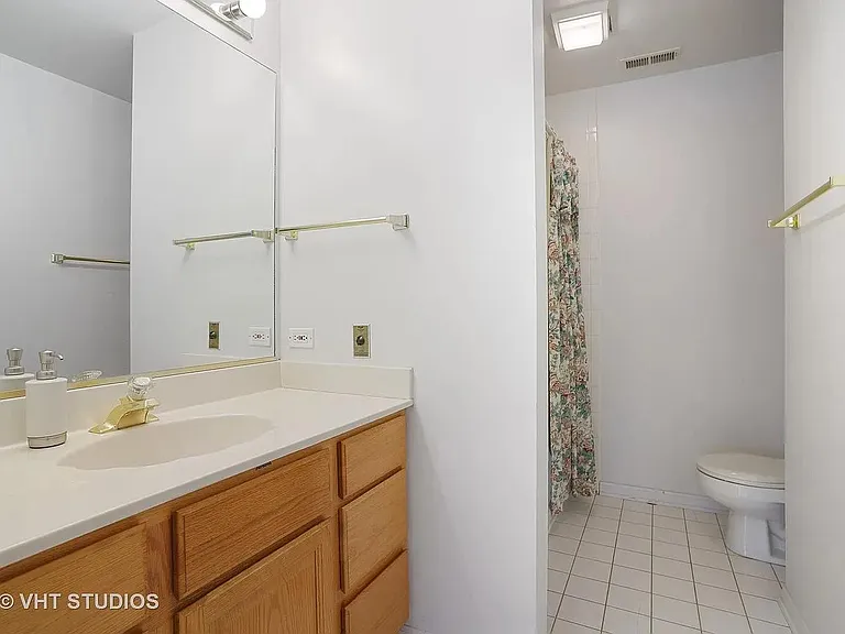Master bathroom with whirlpool tub. Ceramic flooring.