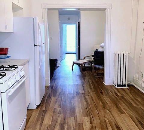 View from dine-in kitchen at back of apartment running through to bedroom at front of apartment