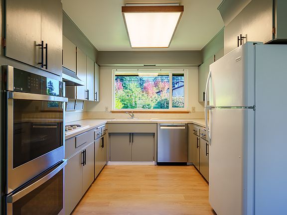 Kitchen with new double ovens and dishwasher