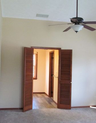 Vaulted ceiling in master bedroom. Looking into master bath / walk in closet