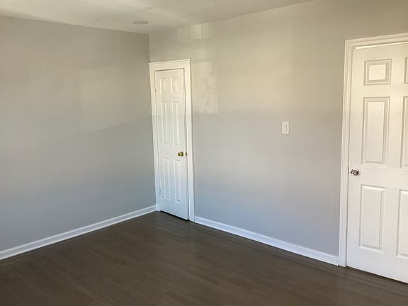 Master bedroom with two nice closets and beautiful hardwood floors that you can only see half of in this picture