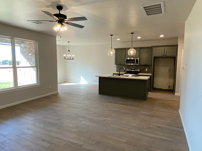 Living room open to Kitchen and Dining
