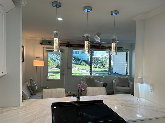 New kitchen ! Look out to gardens and walk out to screened Lani .
