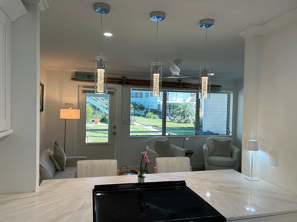 New kitchen ! Look out to gardens and walk out to screened Lani .