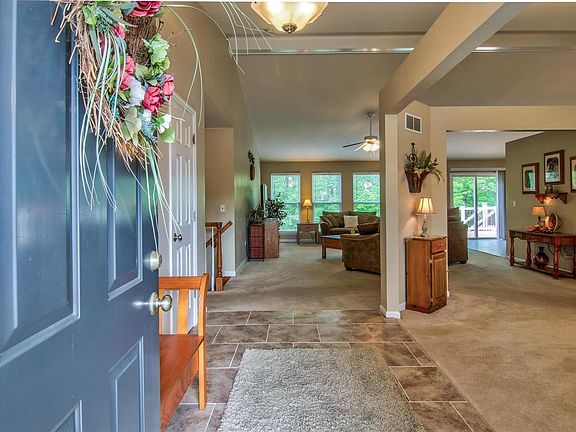 Entry Foyer with Ceramic Tile Flooring . . .