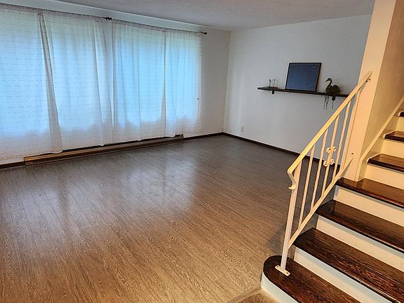 Living room from enterance. Bedrooms and bathroom upstairs.