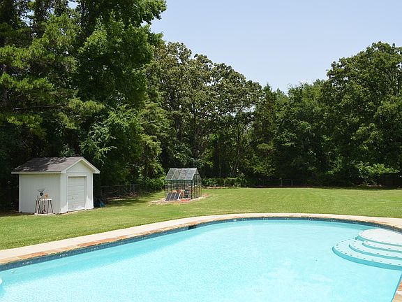 Large back yard with pool.