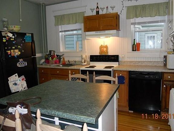 Kitchen with island, dishwasher and now has a flat top range