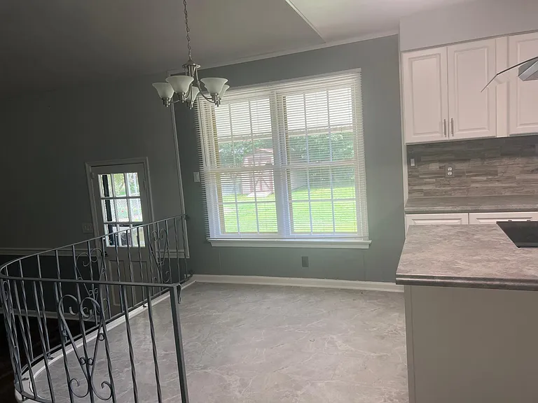 Breakfast area over looks the large back yard and family room