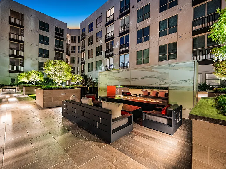 Courtyard lounge with marble fire feature and modern seating