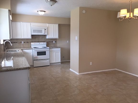 Remodeled kitchen with new appliances and granite