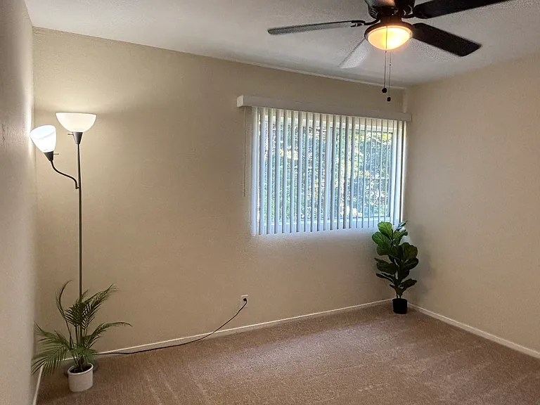 Unit 210B:
Secondary Bedroom with views of Trees
