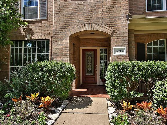 Brick exterior with arched entry and large brick covered porch. Beautiful color greets you! Sprinklers front and backyard!