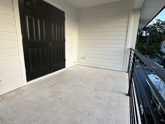 Front double doors and balcony.