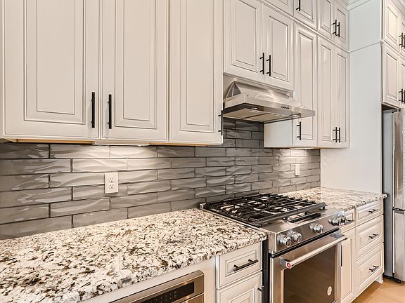 Kitchen glass tiled backsplash