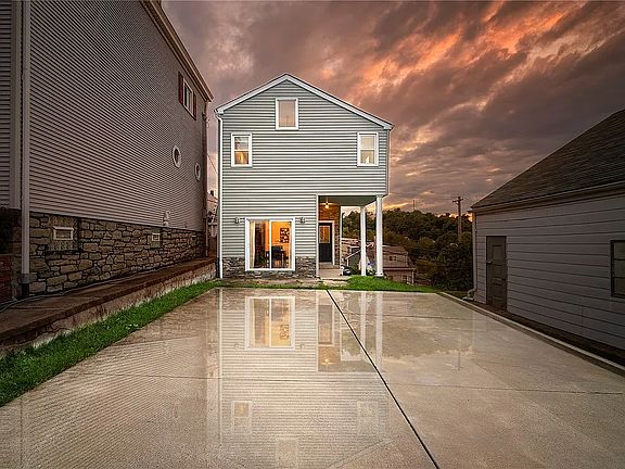 Back view of house and Parking Pad