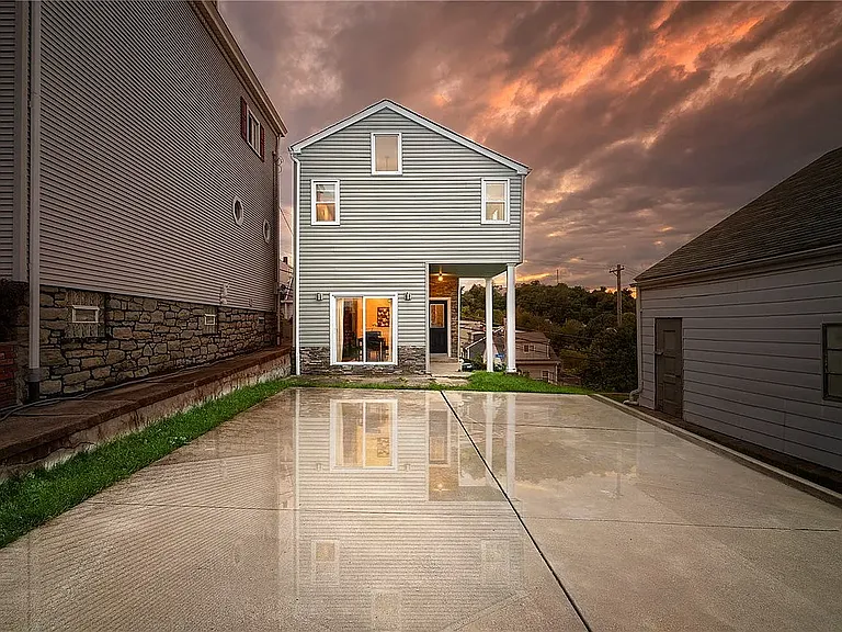 Back view of house and Parking Pad