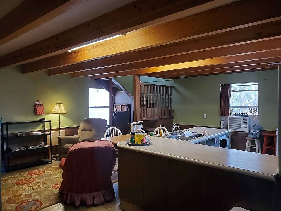 Kitchen & Den with wooden beams.