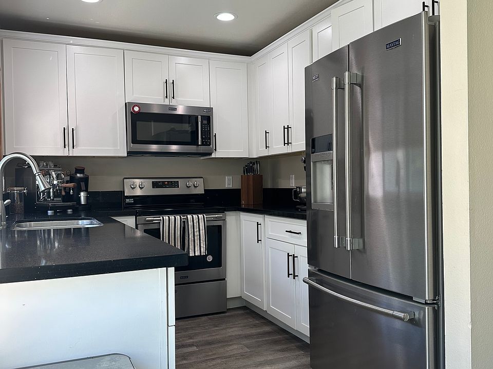 Recently remodeled kitchen with quartz counters, modern finishes, and upgraded appliances_ideal for family meals or entertaining."