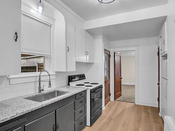 Kitchen 7'x14' looking at side entry door to the left and rear bedroom straight ahead