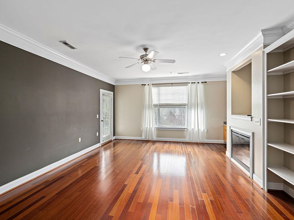 Living room, fireplace, and door to balcony