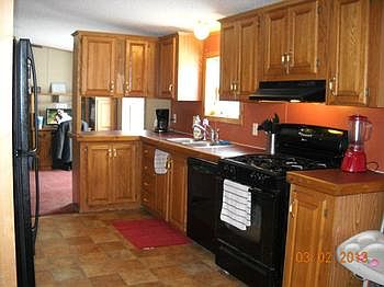 Then view one side of the kitchen. Look at all the cupboard space. Plus more offered on the backside.