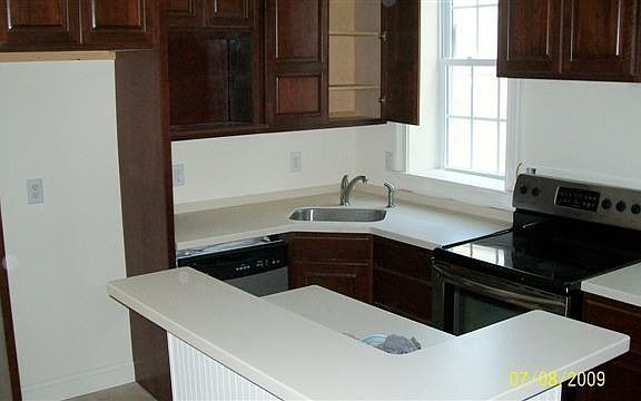 42" Cherry Cabinets Corian Counters