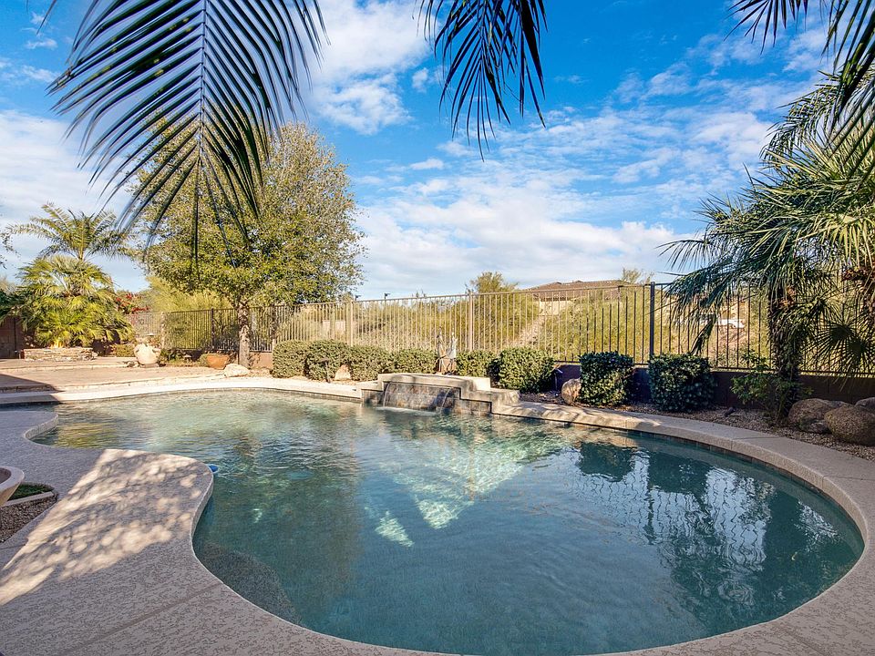 Private backyard with heated pebbletec pool, firepit and mountain views