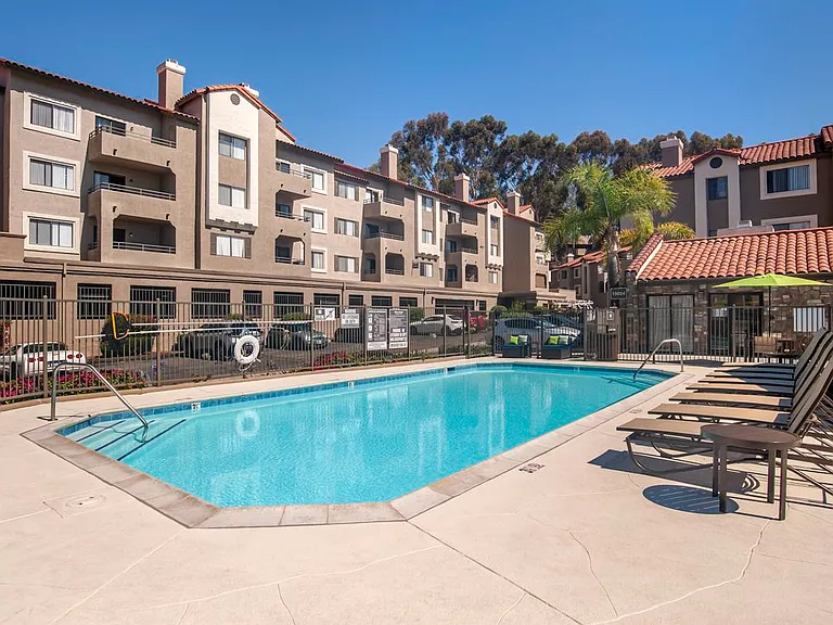 Swimming pool and sundeck with lounge seating