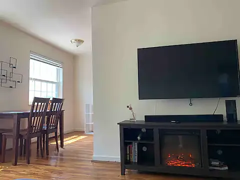Living / dining room with 50", smart television and fireplace
