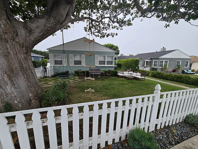 View of front yard and duplex
