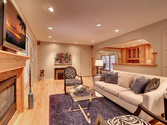 Living rm, 1 of 3 fireplaces