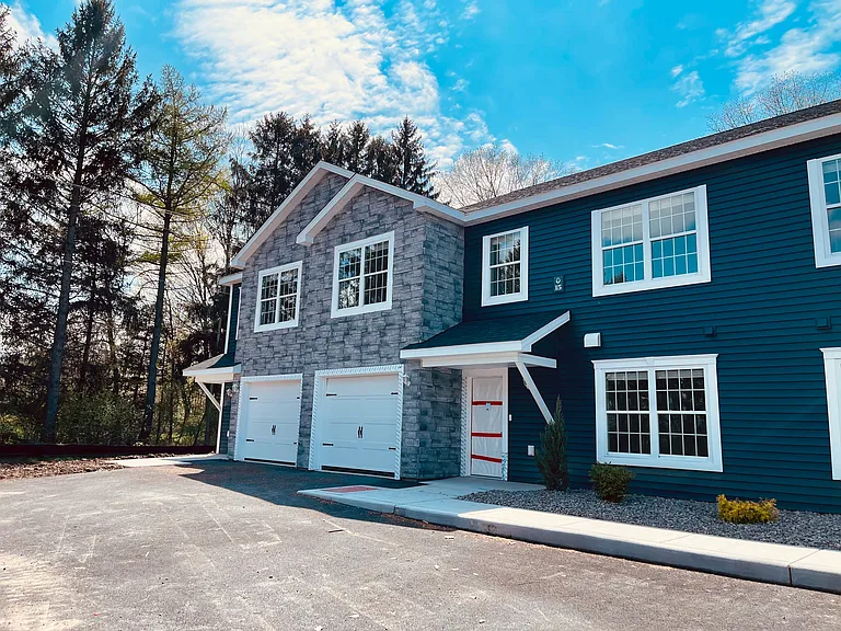 Townhouse front - private entry and attached one car garage