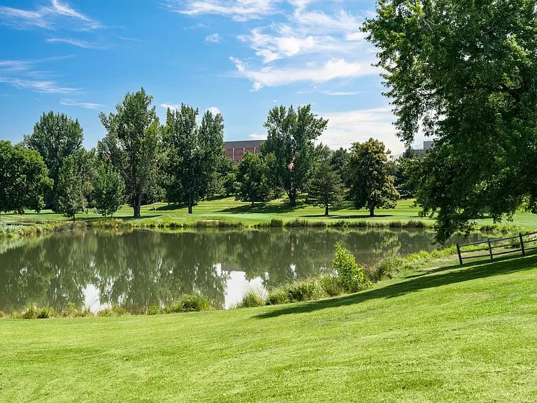 Tranquil pond views and wide-open green space at Harvard Gulch Park_just around the corner from Modera University Park.