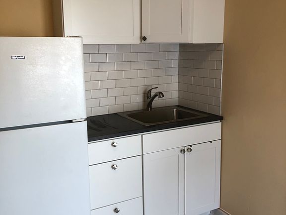 New Kitchen cabinets, countertops, tile backsplash, and floors